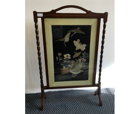 A mahogany firescreen with glazed silk geese by pond design.