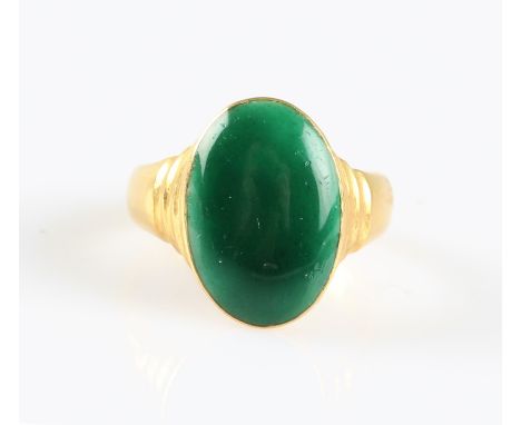A green enamel ring, the oval head featuring green enamel and stepped shoulders, stamped 22 with additional Chinese character