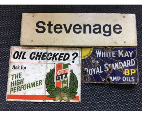 A selection of various advertising signs and posters, including Stevenage train station sign, Castrol GTX, White May and Roya