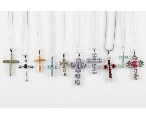 A lot to include ten gemstone set cross pendants, including Jade, Tulelei, topaz, andesine, quartz, ruby and diamond, with ch