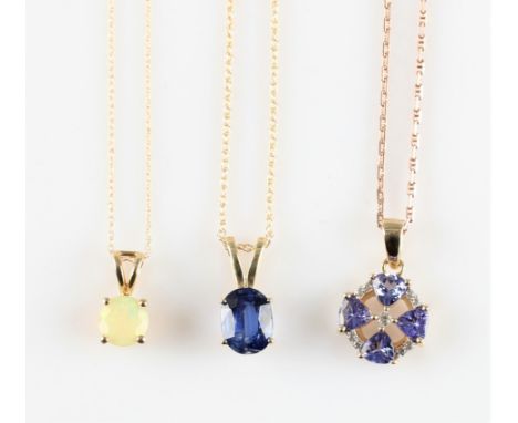 Three pendants, one set with sapphire stamped 10k, one set with opal stamped 10k and the other hallmarked 9ct yellow gold and