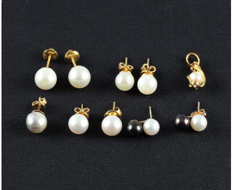 A collection of pearl jewellery, to include four pairs of earrings, a single earring and a pendant.