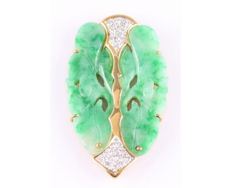 A carved jade and diamond plaque pendant, featuring a carved piece of green jade mounted in yellow metal set with round brill