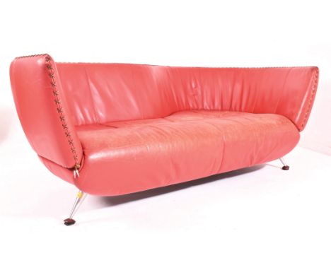 Mathias Hoffmann x De Sede - DS-102 - A contemporary red leather &amp; cross stitch shaped sofa. The sofa having an S shaped 
