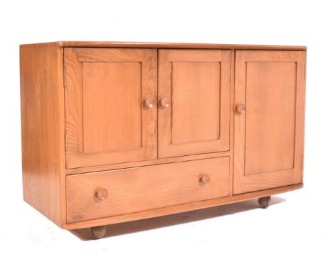 Lucian Ercolani for Ercol - Windsor Range - a retro 1960s elm wood sideboard credenza. The sidebaord having a twin door cabin