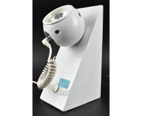 In the manner of Leuchten - a vintage 20th century white plastic magnetic spotlight halo beam desk lamp. The light featuring 
