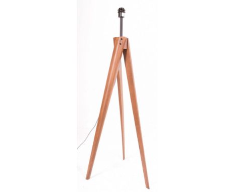 Madison - a contemporary designer floor-standing uplighter lamp light. The lamp raised on walnut tripod splayed base. Sold as