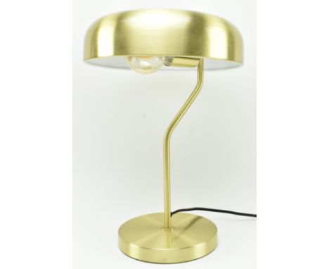 A contemporary designer Hollywood Regency table / desk lamp light. Brass toned mushroom shade supported by a single arm raise