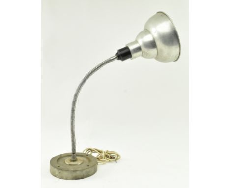 A vintage mid 20th century industrial gooseneck table / desk lamp light. The lamp having an aluminium shade on Bakelite colla