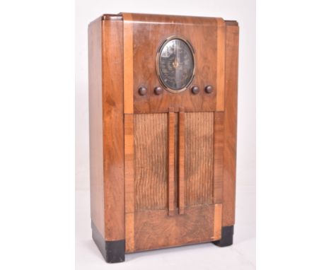 Ferguson - a vintage 20th century Art Deco walnut cased floor standing radio. Classic Deco from with central dial and bakerli