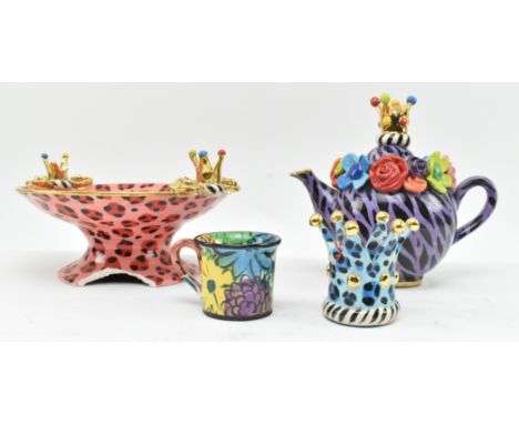 Mary Rose Young - a collection of four vintage early 21st century studio pottery pieces. The lot comprising a pink leopard sp