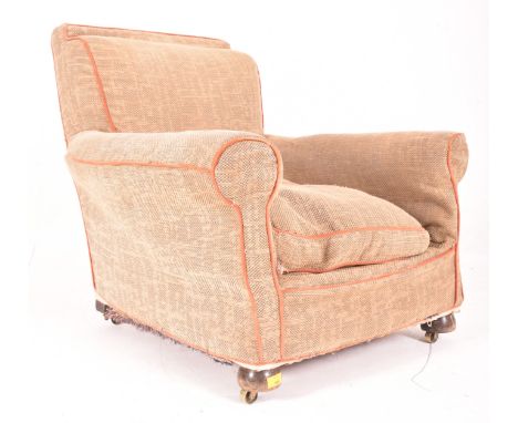 A vintage 20th century fireside club armchair. The chair having a stuffed seat and backrest with scrolled arm rests with all 