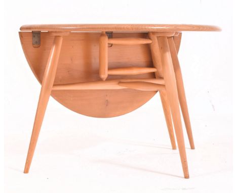 Ercol - Model 308 - a retro circa 1970s drop leaf circular coffee - occasional table. The table raised on tapered legs with c