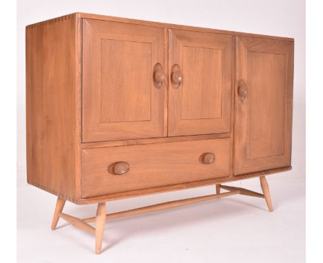 Ercol - Model 467 - a retro mid 20th century circa 1960s blonde beech and elm sideboard on legs. The sideboard having a recta