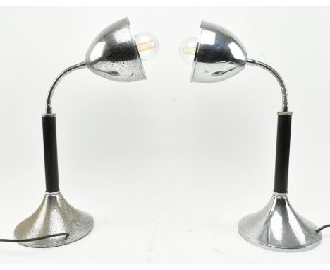 A pair of retro mid century adjustable table / desk lamp lights. Each lamp having chrome pendant shades supported by goosenec