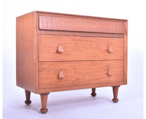 Heals of London - a vintage mid century 1950s teak chest of drawers. The chest of drawers featuring three long drawers, the t