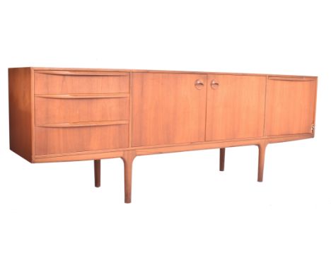 Tom Robertson for McIntosh of Kirkcaldy - a vintage 1970s teak 'Torpedo' sideboard. The sideboard having a pair of central cu