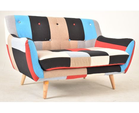 Home Elements - a contemporary designer two seater sofa settee. The sofa having a patchwork cotton fabric upholstery in vibra
