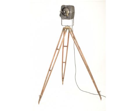 A vintage mid 20th century Adrien De Backer theater / cinema spot lamp light. The lamp raised on a military issue oak and bra