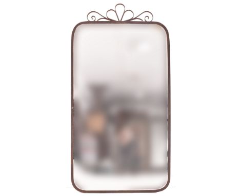 A large vintage wrought iron wall mantel mirror. The mirror having scrolled iron embellishment atop over a rectangular rounde