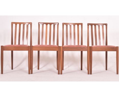 Meredew - a matching set four vintage 20th century teak framed dining chairs. Each chair having rail back backrest with drop 