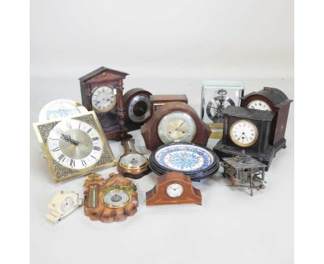 A Victorian black slate mantel clock, 20cm high, together with a collection of various clocks and spares