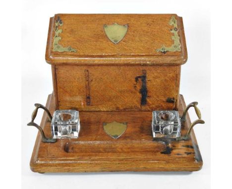 An early 20th century light oak deskstand, with a hinged lid, 21cm high