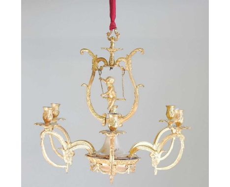 A continental gilt metal six branch chandelier, decorated with a cherub on a swing, 52cm diameter