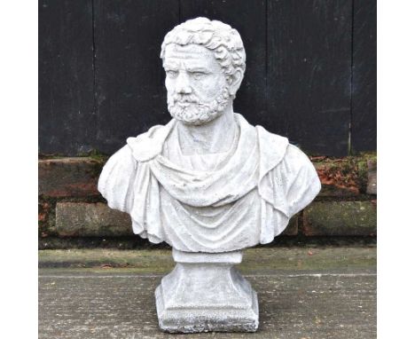 A cast stone portrait bust of Nero, on a socle base