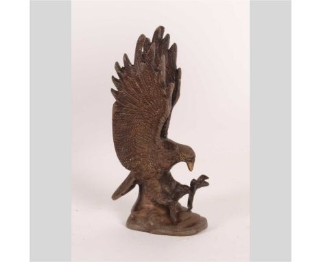 A bronze alloy model of an eagle, shown in flight, 18cm high