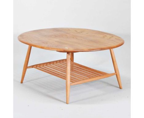 An Ercol light elm two tier coffee table, model 454, on splayed legs united by a spindle undertier100w x 83d x 44h cm