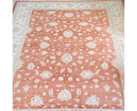 A modern Kashan design carpet, with foliate designs, on red ground, 373 x 280cm