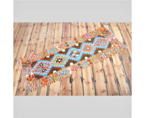 An Afghan kilim runner, with five central diamonds, 197 x 70cm