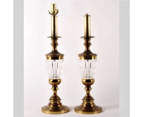 A pair of brass and glass table lamp bases, 66cm high (2)