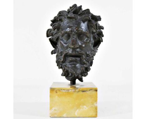 A bronze head of Laocoön, early 20th century, mounted on a marble plinth base, 20cm high