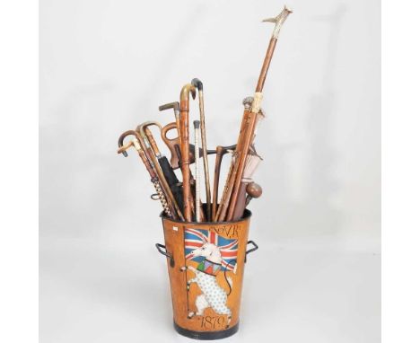 A collection of novelty walking sticks, to include a vertebrae cane, a shooting stick, antler and horn examples, in a painted