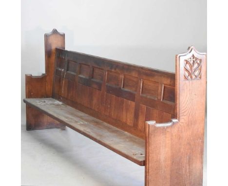 A Victorian light oak pew, with a panelled back and solid seat304w x 56d x 123h cmOverall condition is usable, but very scruf