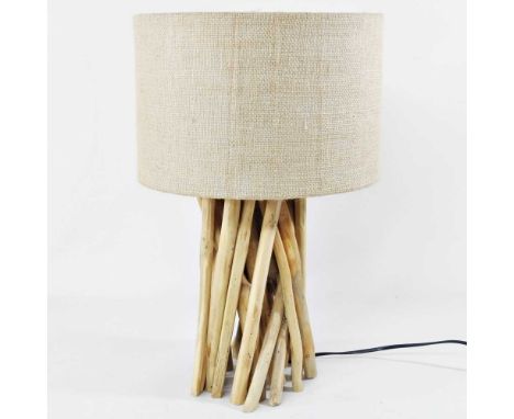 A modern table lamp, constructed from a bundle of sticks, with a hessian shade, 60cm high overall