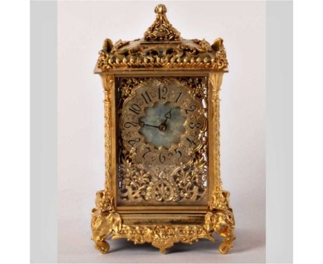 A continental gilt metal mantel clock, with Arabic numbers, the ornate case on elephant mask supports, 18cm high