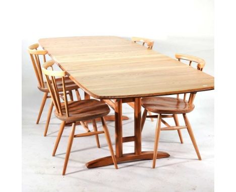 An Ercol light elm draw leaf dining table, with three additional leaves, 252cm overall, together with a set of four Ercol sti