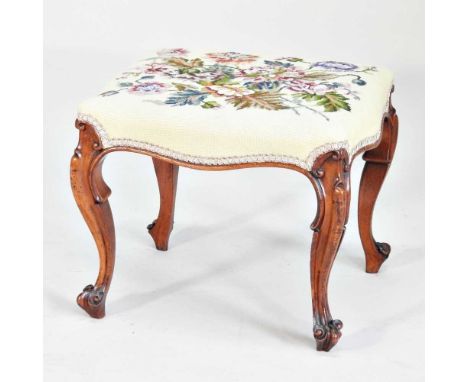 A Victorian carved walnut footstool, with a tapestry seat47w x 42d x 41hcm