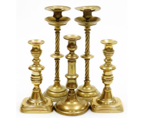 Various late 19thC/early 20thC brass candlesticks, to include a pair on rope twist stem, another on rectangular foot, togethe