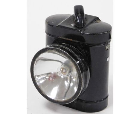 A metal GPO bicycle lamp, with lift up lid and back clip, 11cm high.