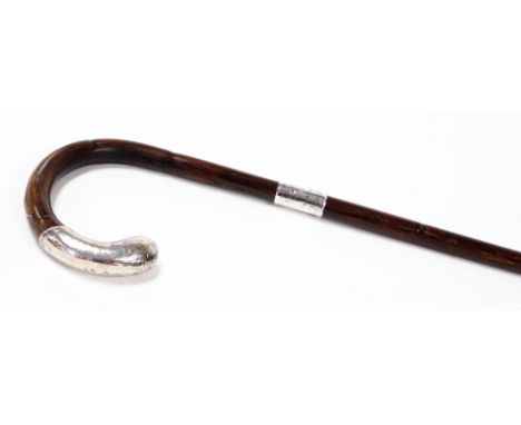 An early 20thC silver handled walking stick,  the mahogany stick with a silver handle, with scroll decoration, and a silver p