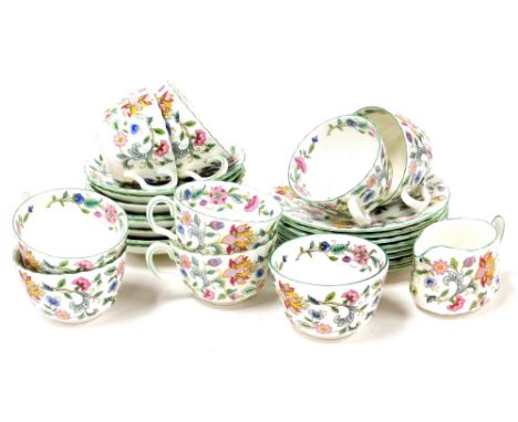 A Minton Haddon Hall pattern part tea service, comprising eight cups and saucers, eight side plates and a milk jug.
