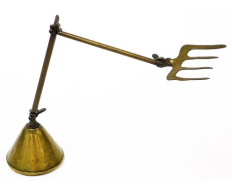 A Victorian anglepoised toasting fork, marked patent number 22048-24, 40cm high.
