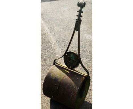 A vintage garden roller, with circular crest depicting a rearing lion, 122cm high.