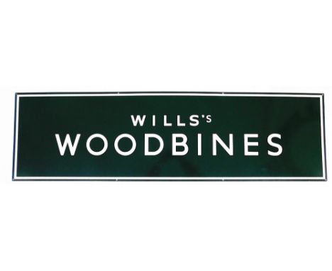 A large enamel advertising sign marked Wills's Woodbines, on green and white enamelling, 153cm wide, 43cm high.