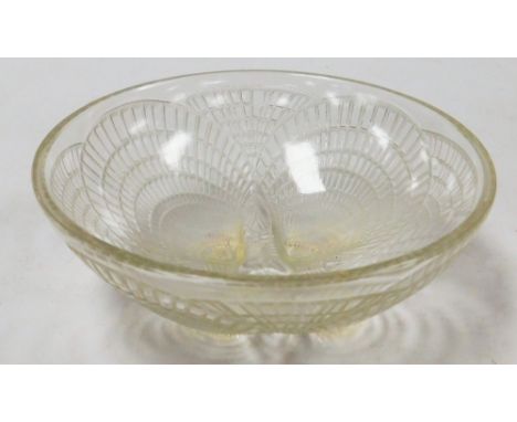 A Lalique Coquilles pattern glass bowl, shaped with four shells on feet in outer decoration, signed R Lalique France NI3204, 