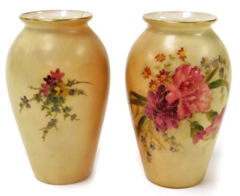 A pair of Royal Worcester blush ivory bud vases, each florally decorated, with sprays of pink and purple flowers, with green 